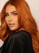 Gaby thumbnail - copper-haired portrait in a black top