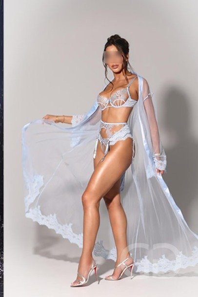 Barbara in pale blue lace lingerie and a sheer flowing robe