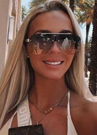 Lulu thumbnail smiling in oversized sunglasses