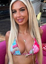 Alana thumbnail in a tropical print bikini, long blonde hair
