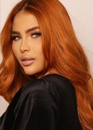 Gaby thumbnail - copper-haired portrait in a black top